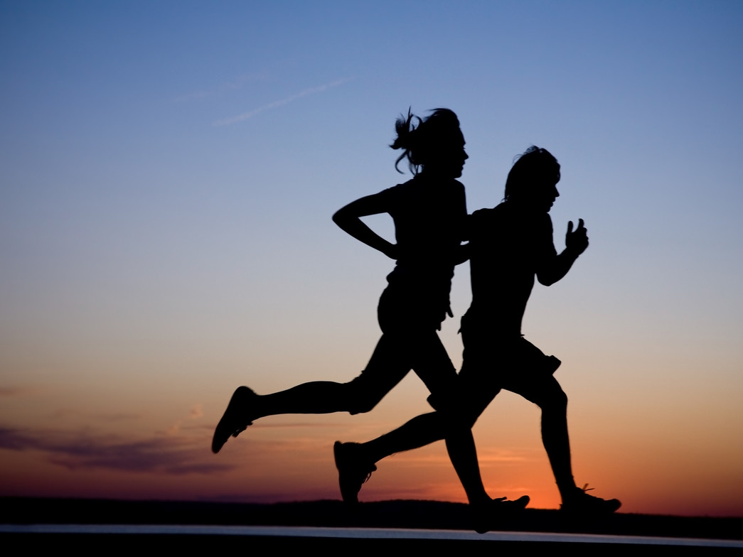 2 people running outside.