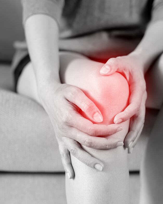 A person holding their knee in pain, ottawa 