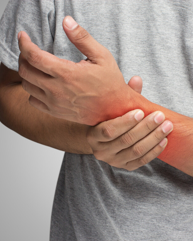 A person holding their wrist 